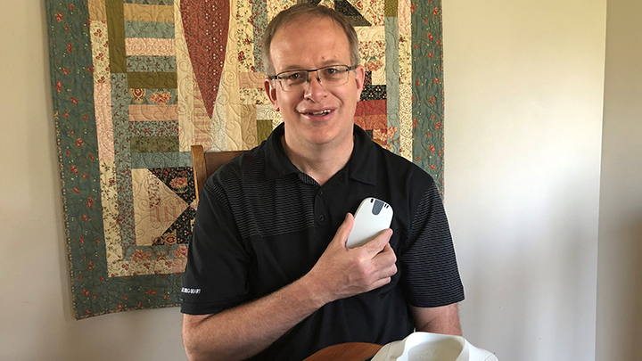 Coronation resident Chris Goodbrand shows the remote monitoring device he uses that transmits information to his cardiac care team in Calgary.