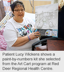 Patient Lucy Wickens shows a paint-by-numbers kit she selected from the Art Cart program at Red Deer Regional Health Centre.