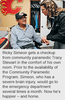 Ricky Simeon gets a checkup from community paramedic Tracy Stewart in the comfort of his own room. Prior to the availability of the Community Paramedic Program, Simeon, who has a severe brain injury, would go to the emergency department several times a month. Now he’s happier – and home.