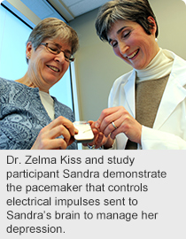 Dr. Zelma Kiss and study participant Sandra demonstrate the pacemaker that controls electrical impulses sent to Sandra’s brain to manage her depression.