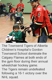The Townsend Tigers of Alberta Children’s Hospital’s Gordon Townsend School dominate the Calgary Flames at both ends of the gym floor during their annual wheelchair hockey game. The Tigers remain undefeated following a 16-1 victory over the NHL squad.