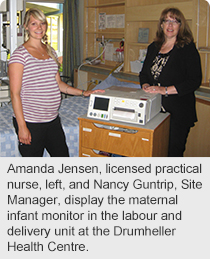 Amanda Jensen, licensed practical nurse, left, and Nancy Guntrip, Site Manager, display the maternal infant monitor in the labour and delivery unit at the Drumheller Health Centre.