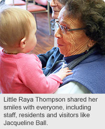 Little Raya Thompson shared her smiles with everyone, including staff, residents and visitors like Jacqueline Ball