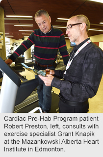 Cardiac Pre-Hab Program patient Robert Preston, left, consults with exercise specialist Grant Knapik at the Mazankowski Alberta Heart Institute in Edmonton.