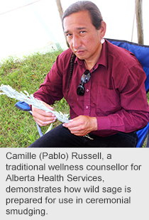 Camille (Pablo) Russell, a traditional wellness counsellor for Alberta Health Services, demonstrates how wild sage is prepared for use in ceremonial smudging.
