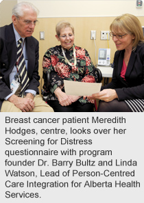 Breast cancer patient Meredith Hodges, centre, looks over her Screening for Distress questionnaire with program founder Dr. Barry Bultz and Linda Watson, Lead of Person-Centred Care Integration for Alberta Health Services.