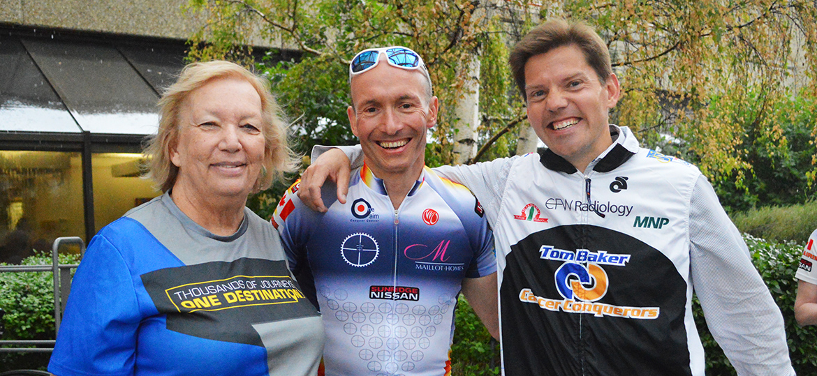 Cancer patient Lynn Silverstone, left, poses with One Aim team leader Dr. Nigel Brockton, a research scientist with CancerControl Alberta, and Tom Baker Cancer Conquerors team leader Dr. Jan-Willem Henning, a medical oncologist at the Tom Baker Cancer Centre, prior to The Enbridge Ride to Conquer Cancer