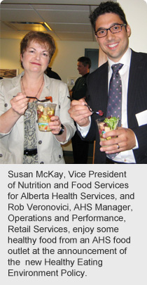 Susan McKay, Vice President of Nutrition and Food Services for Alberta Health Services, and Rob Veronovici, AHS Manager, Operations and Performance, Retail Services, enjoy some healthy food from an AHS food outlet at the announcement of the new Healthy Eating Environment Policy.