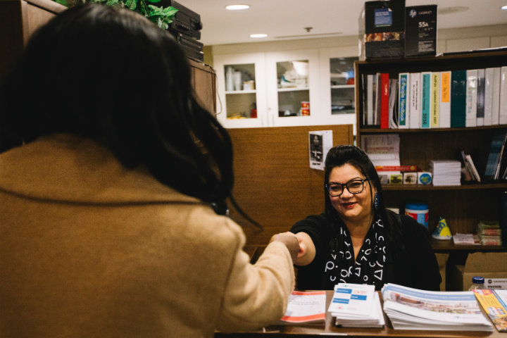 Family Room Coordinator shaking hand