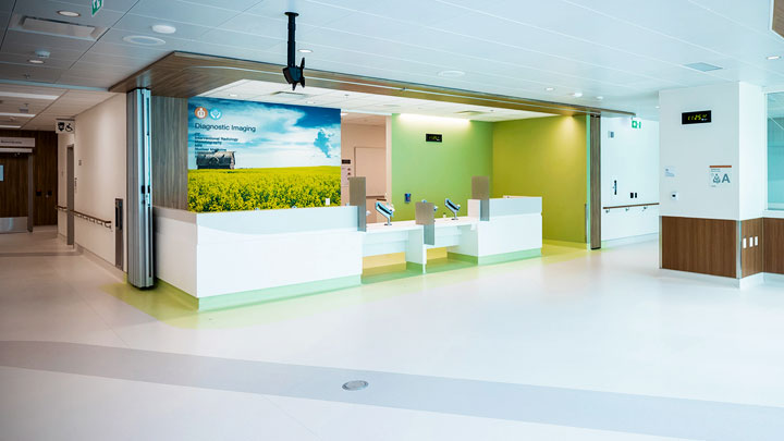 signs on the wall directing patients in the hallways