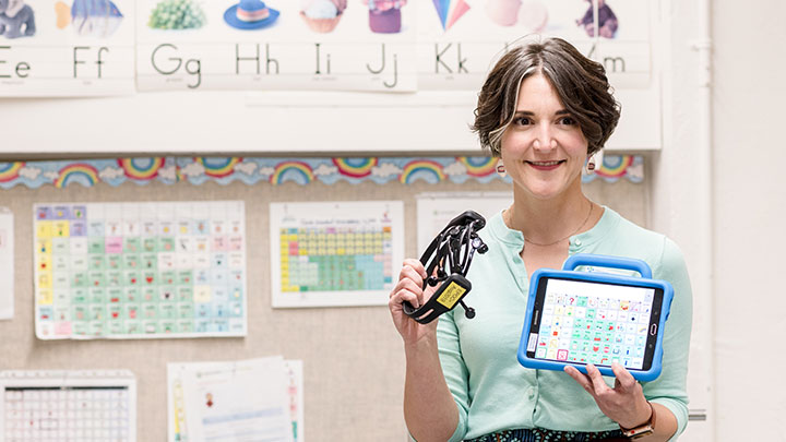 Staff member displaying a high-technology communication device