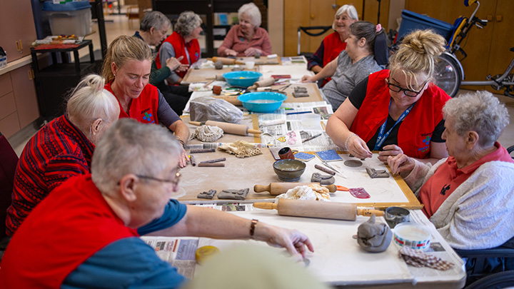 As the group of residents and volunteers work, laughter is heard throughout the unit.