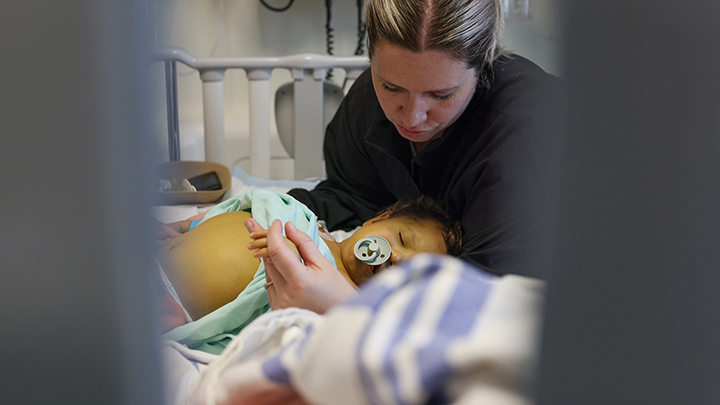 Stephanie comforts her son Colby as he awaits a transplant.