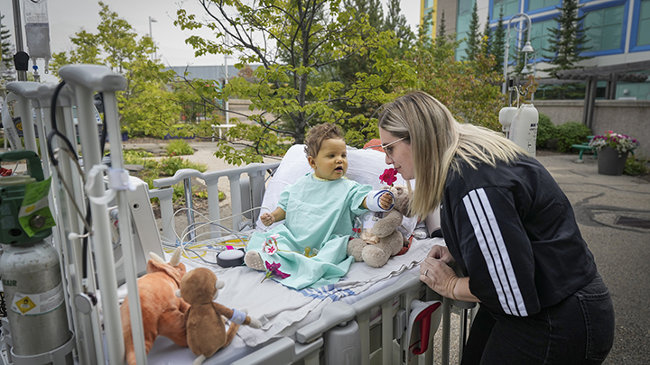 Stephanie and Colby enjoy the warm weather outside the hospital.