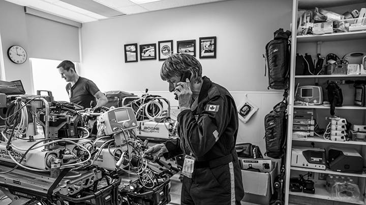 In the SANTS prep room, a respiratory therapist checks her pager and makes a call, while a colleague readies transport gear. The SANTS team is highly trained in neonatal respiratory care, resuscitation and high-risk transport - and ready to respond at a moment's notice.
