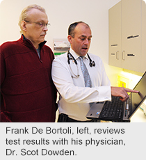 Frank De Bortoli, left, reviews test results with his physician, Dr. Scot Dowden.