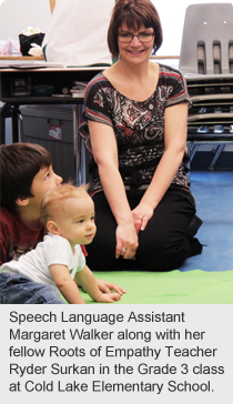 : Speech Language Assistant Margaret Walker along with her fellow Roots of Empathy Teacher Ryder Surkan in the Grade 3 class at Cold Lake Elementary School. 