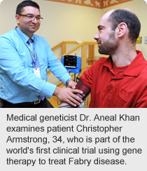 Medical geneticist Dr. Aneal Khan examines patient Christopher Armstrong, 34, who is part of the world's first clinical trial using gene therapy to treat Fabry disease.