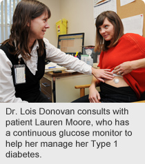Dr. Lois Donovan consults with patient Lauren Moore, who has a continuous glucose monitor to help her manage her Type 1 diabetes.
