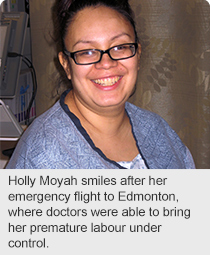Holly Moyah smiles after her emergency flight to Edmonton, where doctors were able to bring her premature labour under control