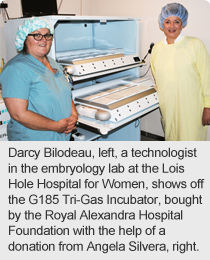 Darcy Bilodeau, left, a technologist in the embryology lab at the Lois Hole Hospital for Women, shows off the G185 Tri-Gas Incubator, bought by the Royal Alexandra Hospital Foundation with the help of a donation from Angela Silvera, right.