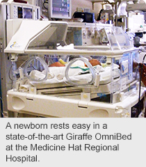 A newborn rests easy in a state-of-the-art Giraffe OmniBed at the Medicine Hat Regional Hospital.