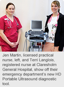 Jen Martin, licensed practical nurse, left, and Terri Langlois, registered nurse at Claresholm General Hospital, show off their emergency department’s new HD Portable Ultrasound diagnostic tool