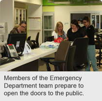 Members of the Emergency Department team prepare to open the doors to the public.