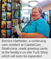 Bernice Hartfelder, a continuing care resident at CapitalCare Strathcona, reads greeting cards at the facility’s on-site Tuck Shop, which will soon be expanded.