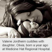 Valene Jordheim cuddles with daughter, Olivia, born a year ago at Medicine Hat Regional Hospital.