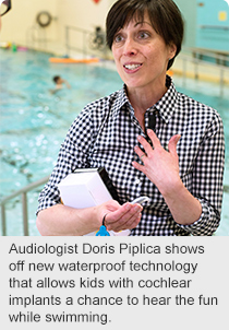 Audiologist Doris Piplica shows off new waterproof technology that allows kids with cochlear implants a chance to hear the fun while swimming