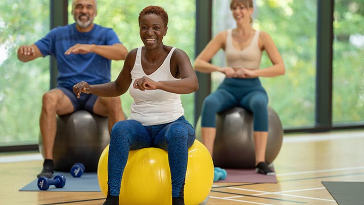 three people in exercise class