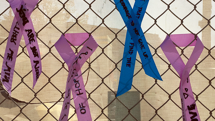 A few of the inspirational ribbons — each adorned with messages of love and hope — hang on the construction fence at the new Calgary Cancer Centre.