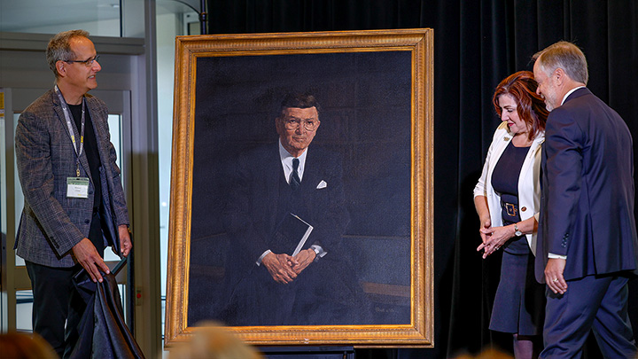 AHS President and CEO Mauro Chies, left, and Minister of Health Adriana LaGrange help Lorne Jacobson, Vice Chairman & Co-Founder, TriWest Capital Partners, and lead Trustee of the Arthur J.E. Child Foundation, to unveil a painting of the late philanthropist Arthur Child, for whom the new Arthur Child will be named. Photo by Leah Hennel