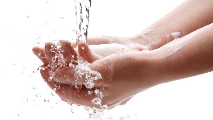 person washing their hands