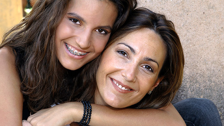 mother and daughter embracing