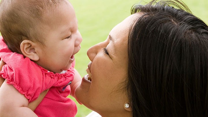 mother smiling at baby