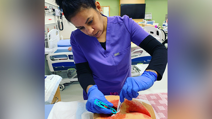 While attending school to become a Health Care Aide, Merrier and her classmates honed their new skills in the labs at Grande Prairie Regional Hospital.