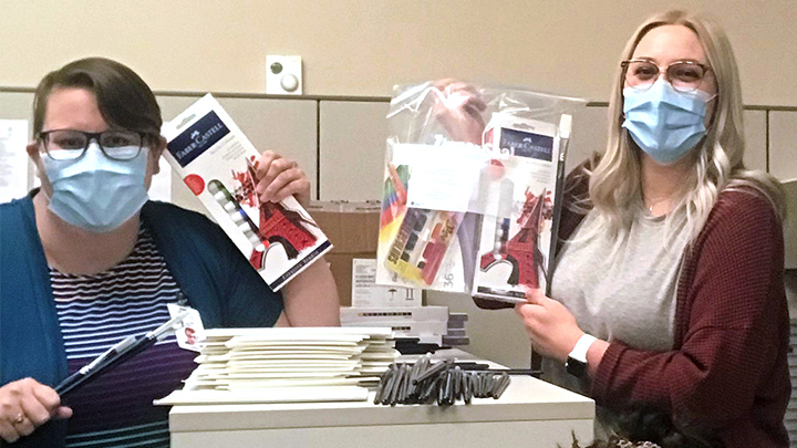 Holding art supplies are: Amber Vanderkroft, left, a Lethbridge College student; therapy aide Hannah Yunick, right, and recreation therapist Heidi Davis, in front. Thanks to the Darlene Murphy Building Capacity Bursary, art kits are being given for free to clients of the Therapeutic Recreation Creative Journey virtual health therapy group in South Zone.