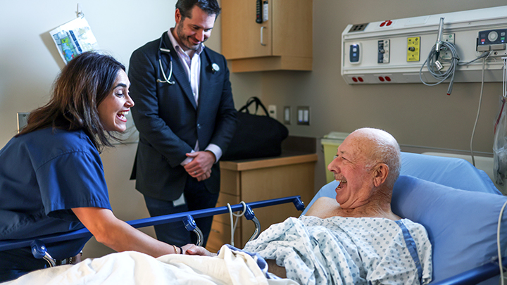Nancy Tawil, CEO of Qeen Biotechnologies, left, and infectious diseases physician Dr. Stephen Vaughan enjoy a lighter moment with their patient Boyd English.