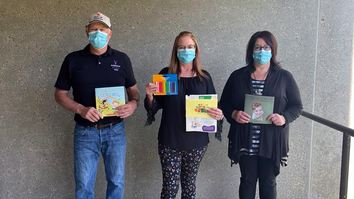 The Alberta Health Services Child & Youth Health Team in Barrhead recently celebrated a $3,000 donation from the Barrhead Elks Club toward a childhood development program for families in the community. Shown from left are Calvin Fischer of the Barrhead Elks Club and members of the Child & Youth Health Team; Tracey Mueller, speech assistant, and Melody Ulmer, Infant & Child Development coordinator, with sample materials provided as part of the program.