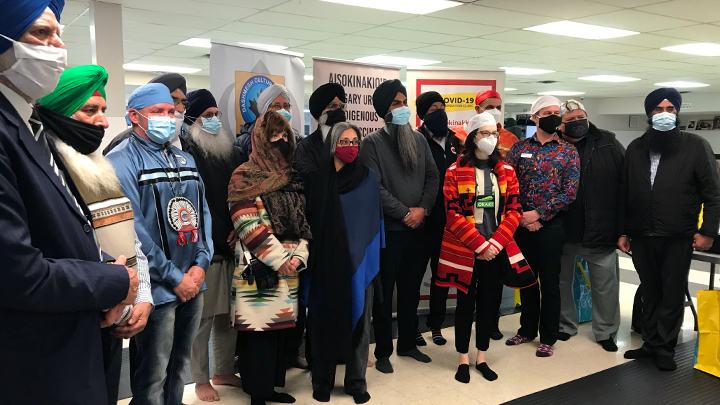 Nick Thain, third from right, senior operating officer of Community, Rural and Continuing Care for Calgary Zone, joined community partners at the Dashmesh Cultural Centre in February in support of ongoing COVID-19 immunization efforts in northeast Calgary.