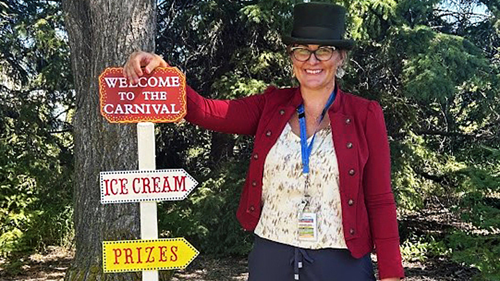 Volunteer resources coordinator Carina Moran donned a top hat to welcome fairgoers to the carnival.