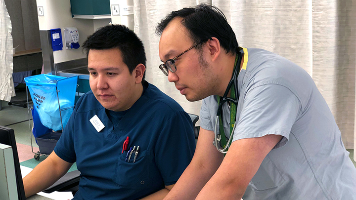 Connect Care’s Wave 1 Implementation has been named the 2021 recipient of the Canadian College of Health Leaders’ 2021 3M Health Care Quality Team Awards (Across a Health System). Shown here, Emergency Department nurse Jesse Alook, left, and third-year resident Raymond Chu admit the first patient under the Connect Care system at 4:31 a.m. Sunday, Nov. 3 — launch day at the University of Alberta Hospital in Edmonton.