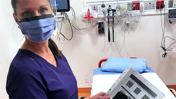 Randi Knutson, a clinical nurse educator at Chinook Regional Hospital, displays a page of QR codes, which are shared with Emergency Department patients to help them with their discharge instructions and follow-up care.