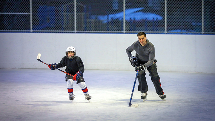Chris Snow and son Cohen hit the rink in 2020 for some hockey practice. At the time, he served as the Calgary Flames assistant general manager.