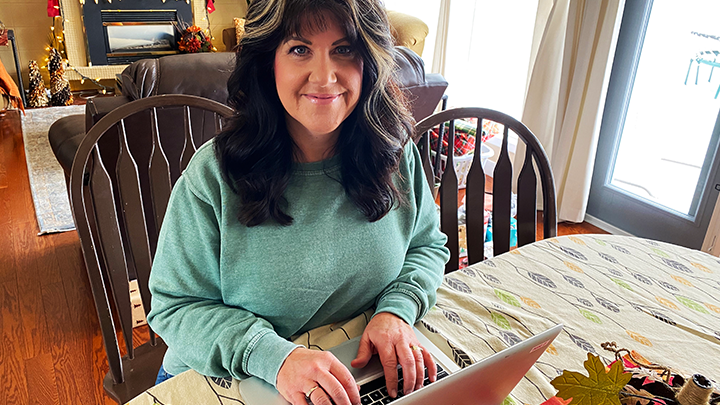 Registered Nurse Deb Greeno fires up her home laptop to stem the spread of COVID-19 as a contact tracer for Alberta Health Services.