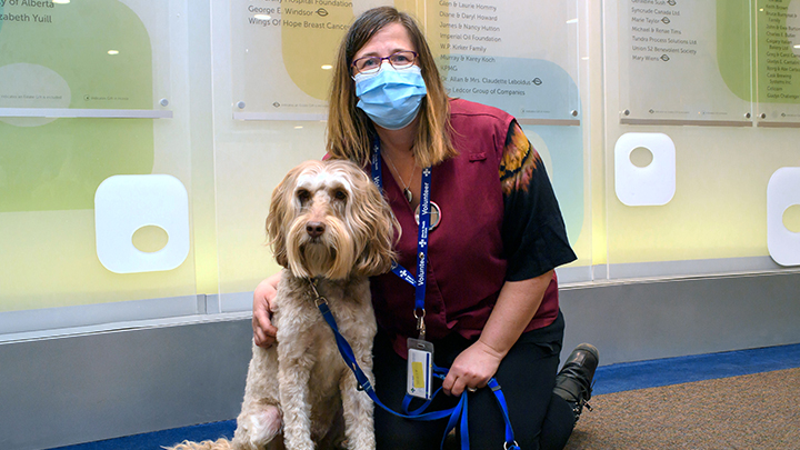 Bev Koo and Messi, her Australian labradoodle, bring joy and a welcome distraction from the serious business of radiation therapy to patients in the waiting areas at the Cross Cancer Institute.