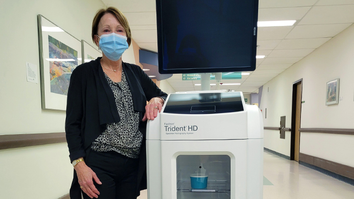 Deryl Comeau poses next to the Hologic Faxitron, new medical X-ray equipment purchased through her donation to the Red Deer Regional Health Foundation.