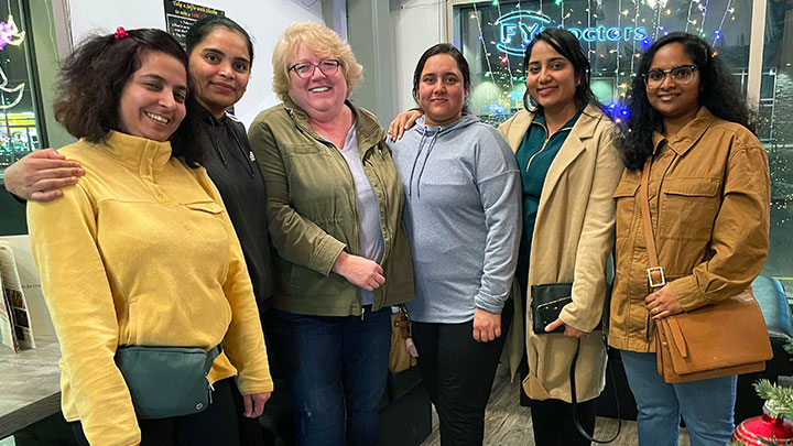 Fox Creek Site Manager Tracy Brown, centre, believes welcoming new DIENs is as much about welcoming them to the community as it is about welcoming them to the workplace. From left are: Kranti Nepal, LPN; Khushbu Patel, HCA; Brown; Gurpreet Kaur, RN; Kiranjeet Kaur, RN; and Neethu Mohanan, RN.
